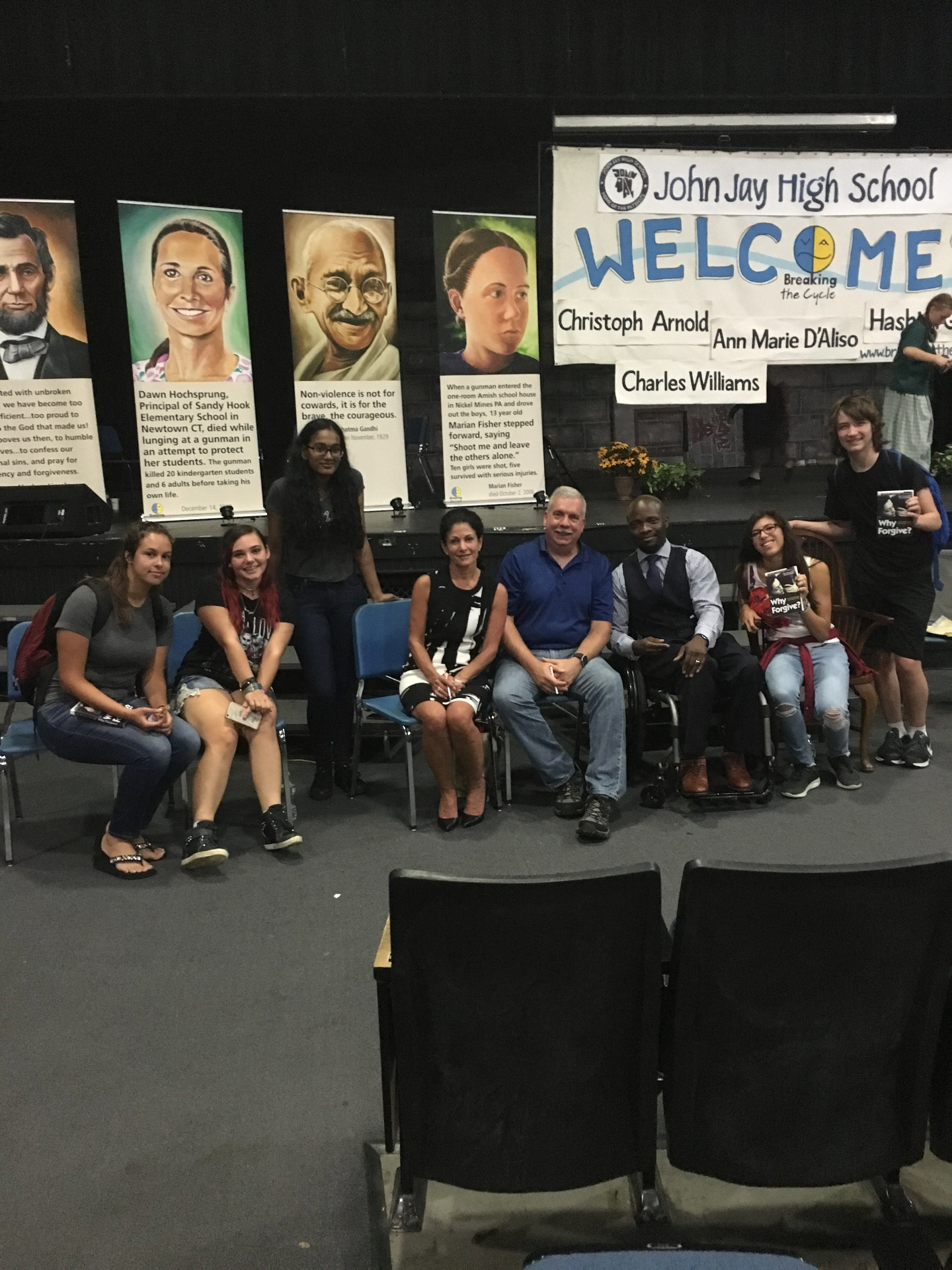 Group photo with John Jay High School students and banners